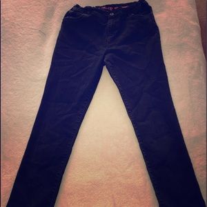 The children place black jeans